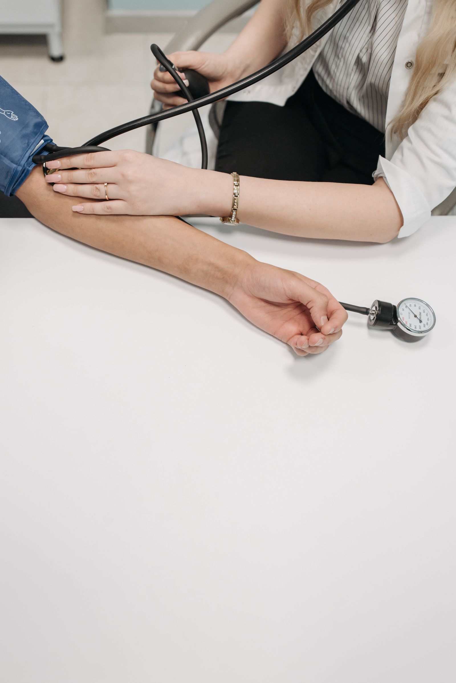 A blood-pressure cuff on a patient's arm