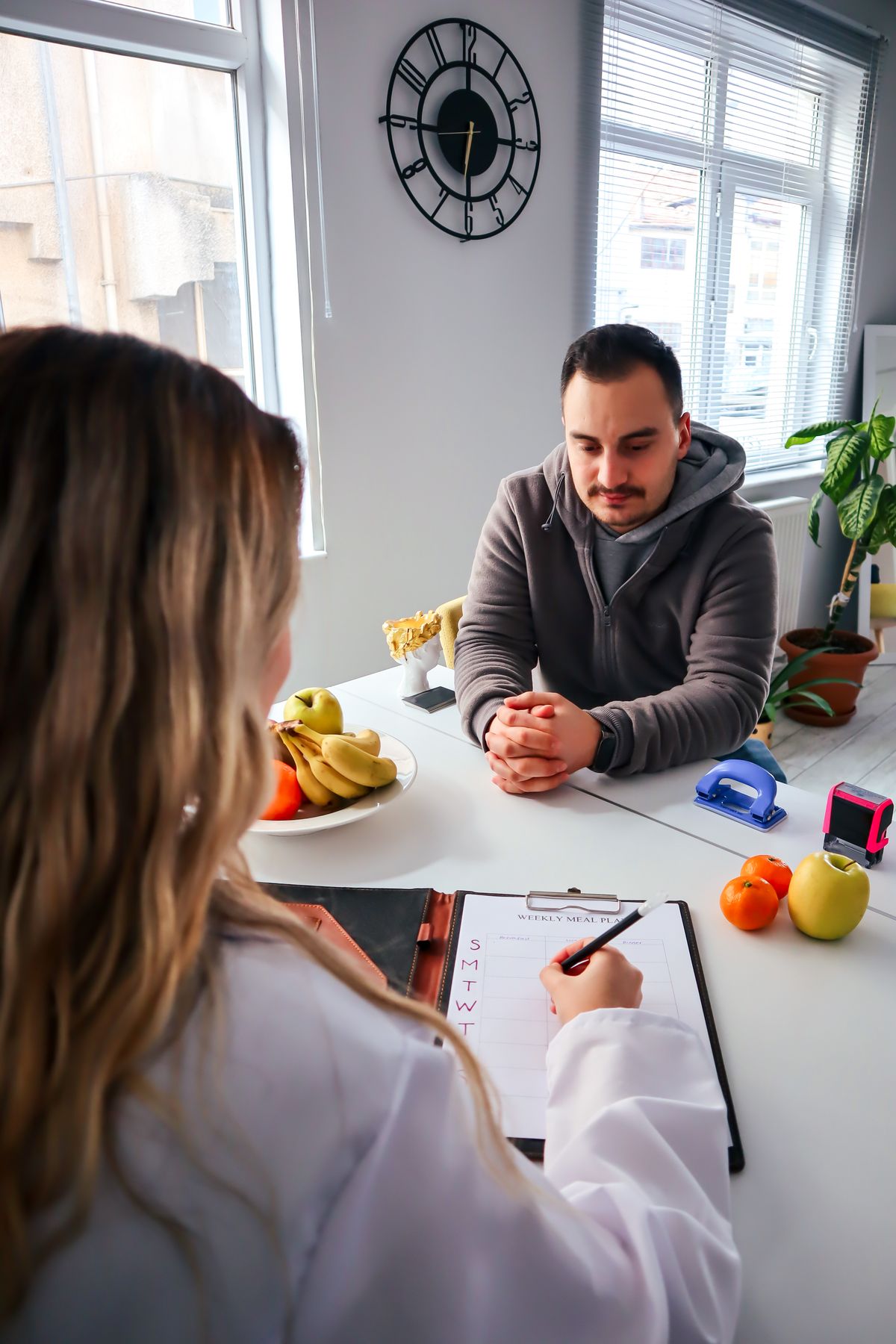 A consultation about diet with fresh food on the table
