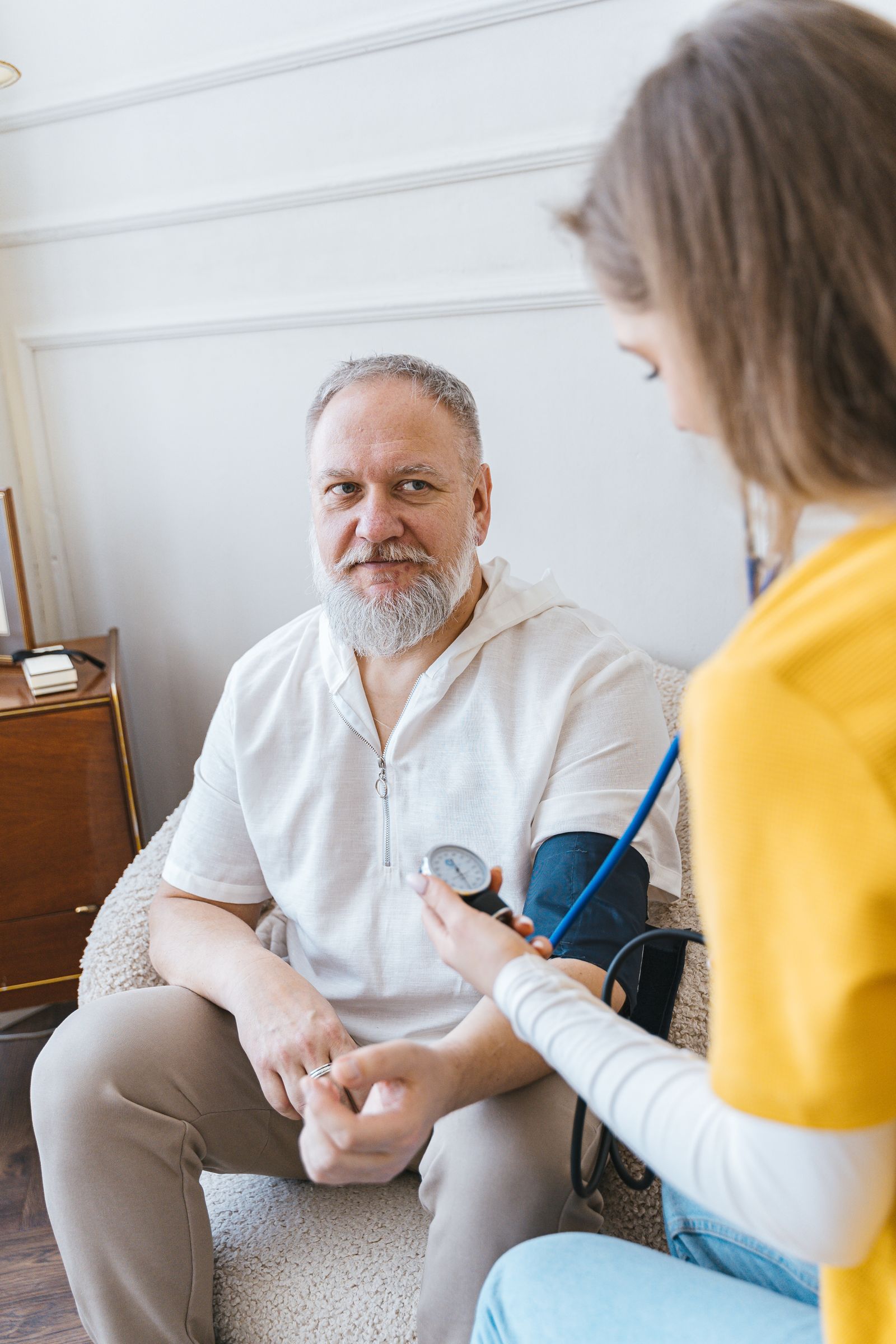 An older man having his blood pressure taken