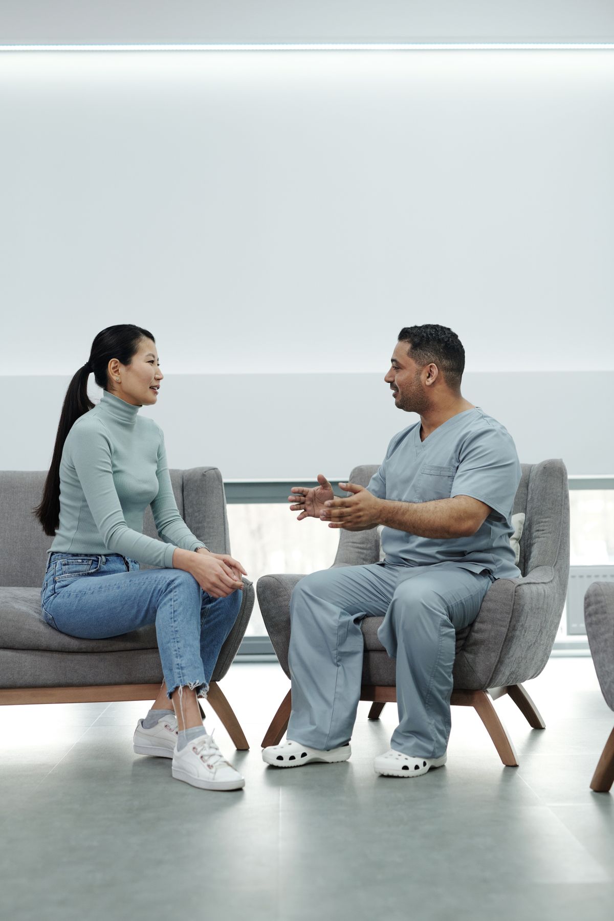 A clinician talking with a patient